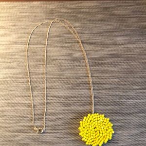Gold chain necklace with yellow beaded piece